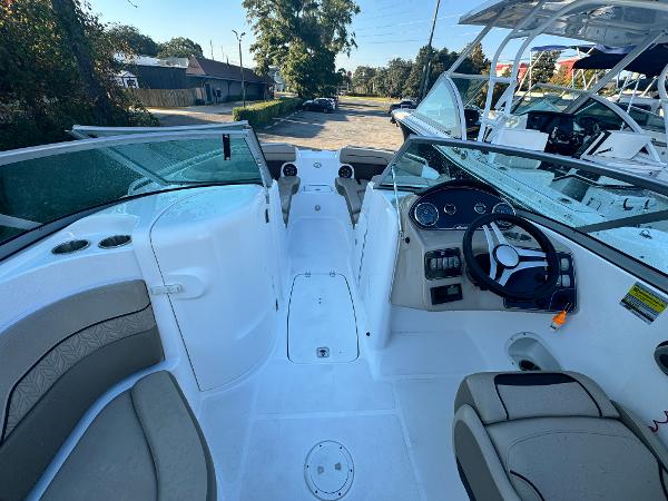 Slide: The Image of 2023 Hurricane SunDeck 2200 DC OB boat interior with seating and steering console. - 18