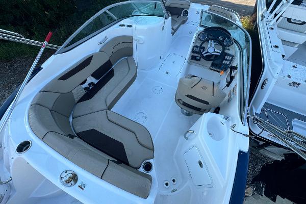 Slide: The Image of 2023 Hurricane SunDeck 2200 DC OB boat interior with seating and control panel. - 20