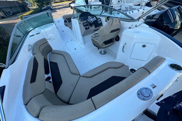 Slide: The Image of 2023 Hurricane SunDeck 2200 DC OB boat interior with spacious seating and modern dashboard. - 22