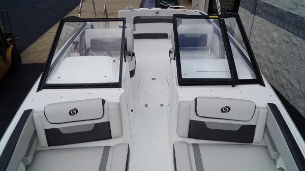 Slide: The Image of 2023 Hurricane SunDeck 235 OB boat interior with open windshield and seating. - 13