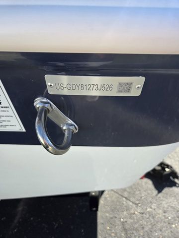 Slide: The Image of 2026 Hurricane SunDeck Sport 201 IO boat with identification plate and hook detail. - 15