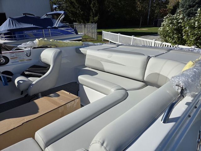 Slide: The Image of 2026 Hurricane SunDeck Sport 201 IO boat interior with plush seating and modern design. - 4
