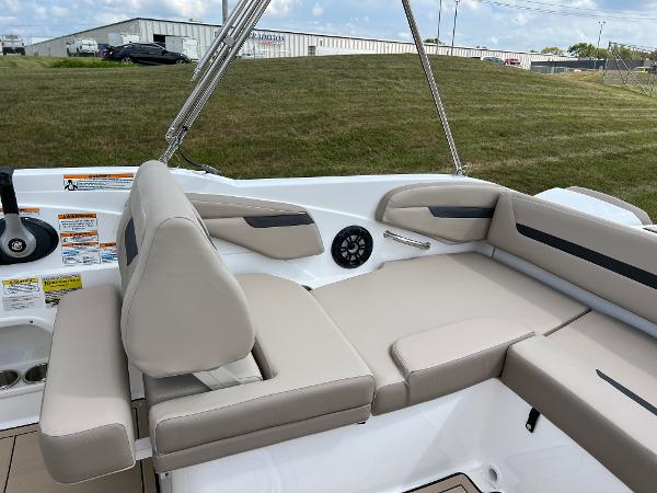 Slide: The Image of 2024 Hurricane SunDeck Sport 205 IO boat interior with beige seating and modern design. - 21