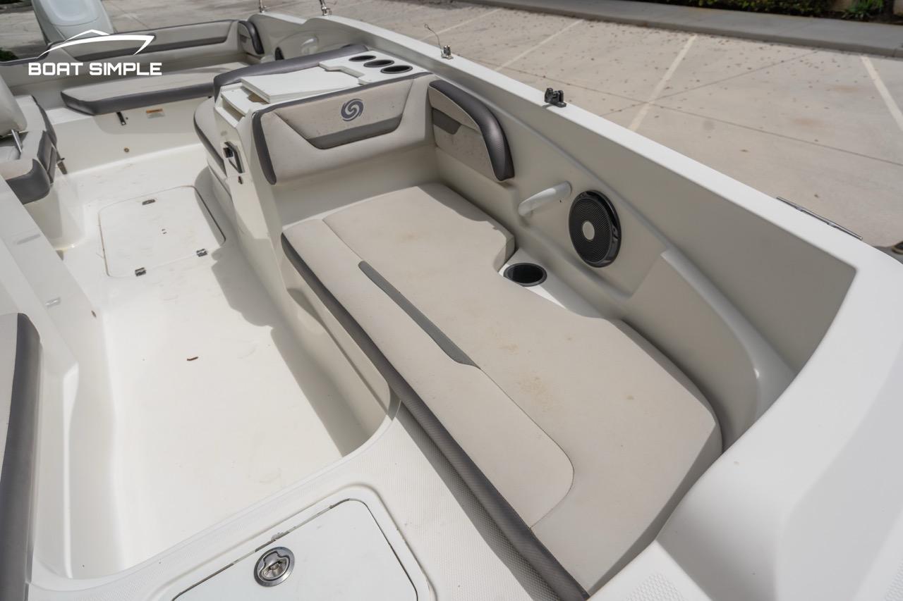 Slide: The Image of 2021 Hurricane SunDeck Sport 205 OB interior with seating, cup holder, and speaker. - 14