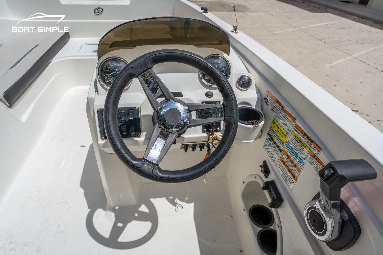 Slide: The Image of 2021 Hurricane SunDeck Sport 205 OB boat dashboard with steering wheel and controls. - 7