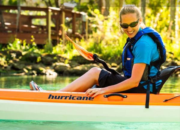 Slide: The Image of Woman kayaking in a 2023 Hurricane Kayaks Skimmer 116 First Class on a sunny day. - 6