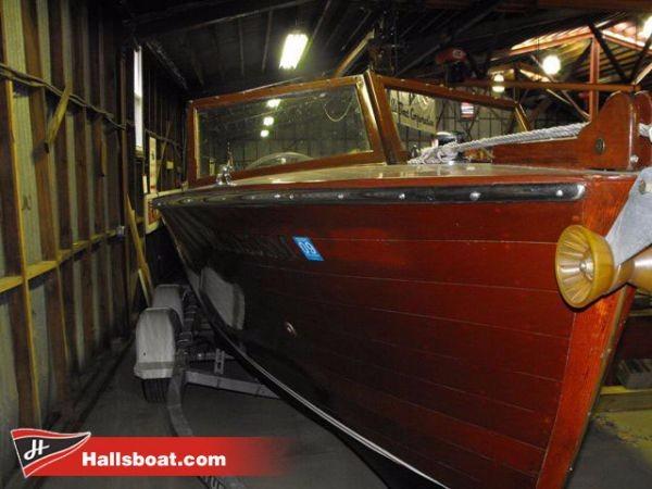 Slide: The Image of 1950 Hutchinson Utility wooden boat in storage at Hallsboat.com. - 1