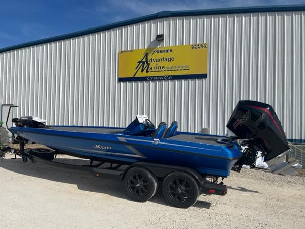 Slide: The Image of 2024 iKon LX21 blue boat on trailer outside Advantage Marine sales and service. - 1
