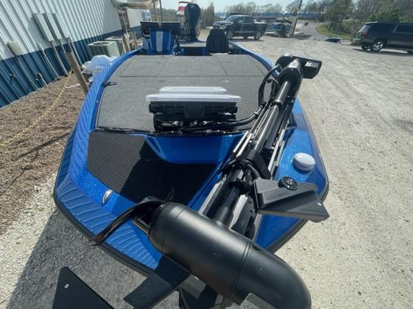 Slide: The Image of 2024 iKon LX21 blue fishing boat with advanced equipment on a gravel lot. - 12
