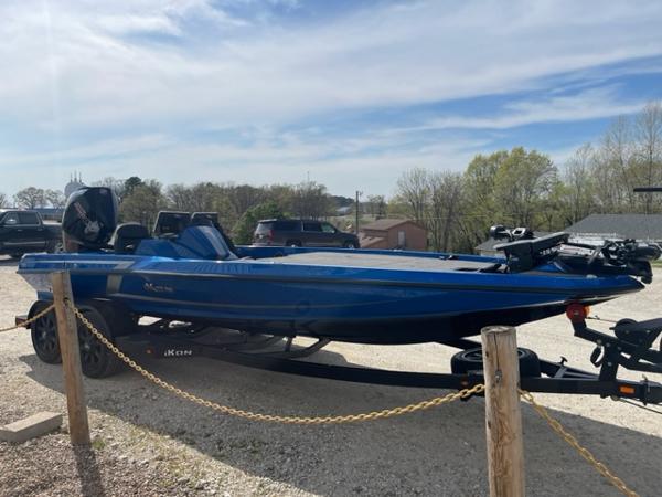 Slide: The Image of 2024 iKon LX21 blue fishing boat on trailer in outdoor lot. - 3
