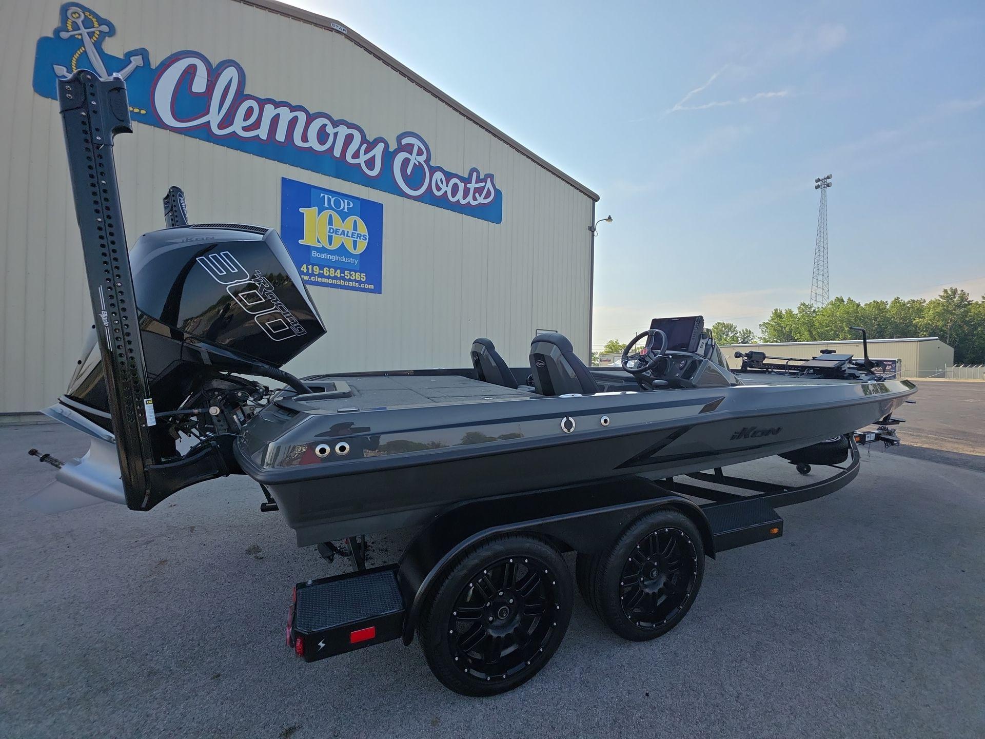 Slide: The Image of 2025 iKon LX21 boat at Clemons Boats dealership, featuring sleek design and powerful engine. - 0