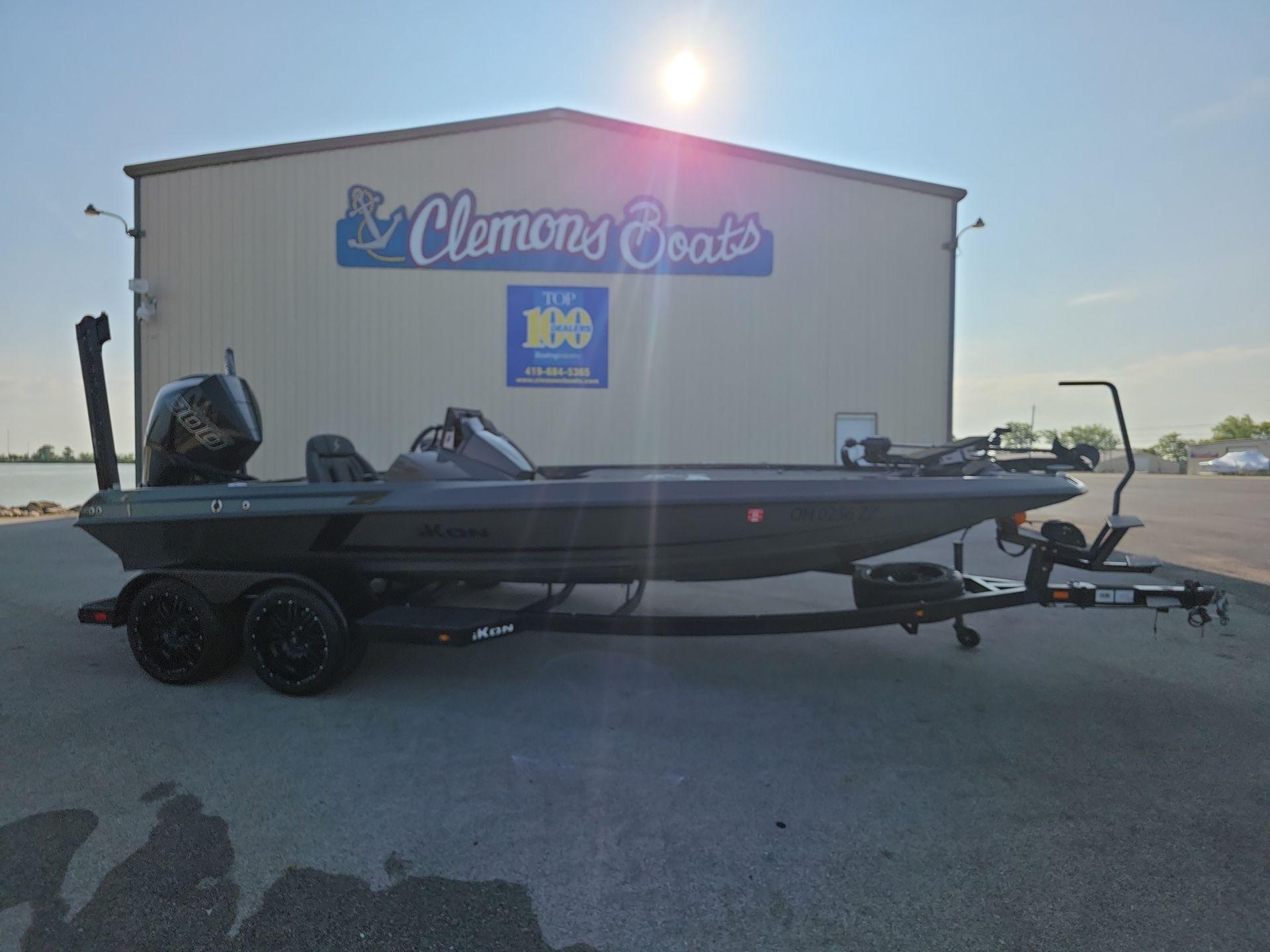 Slide: The Image of 2025 iKon LX21 boat on trailer at Clemons Boats dealership. - 1