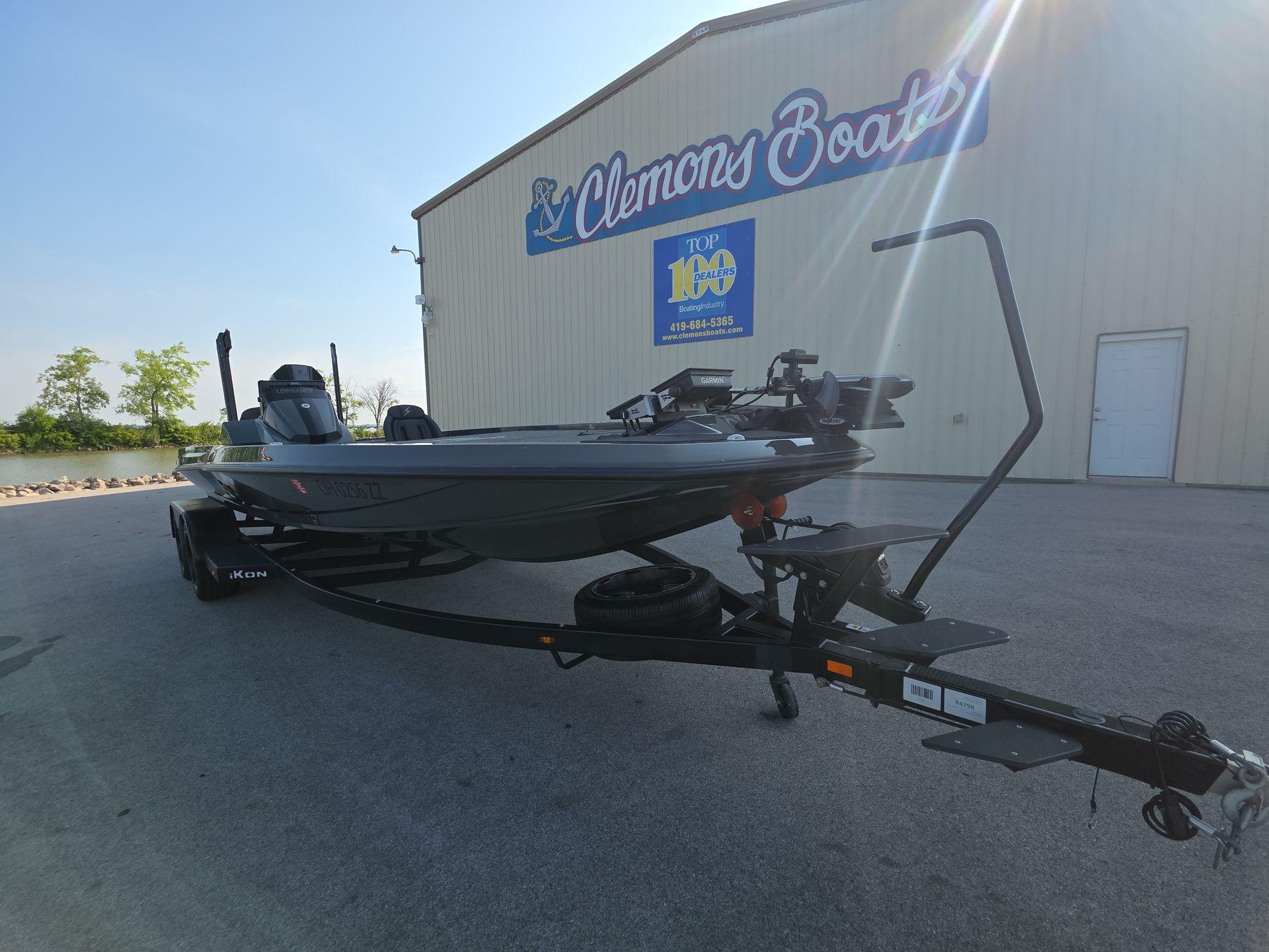 Slide: The Image of 2025 iKon LX21 boat on trailer at Clemons Boats dealership. - 3