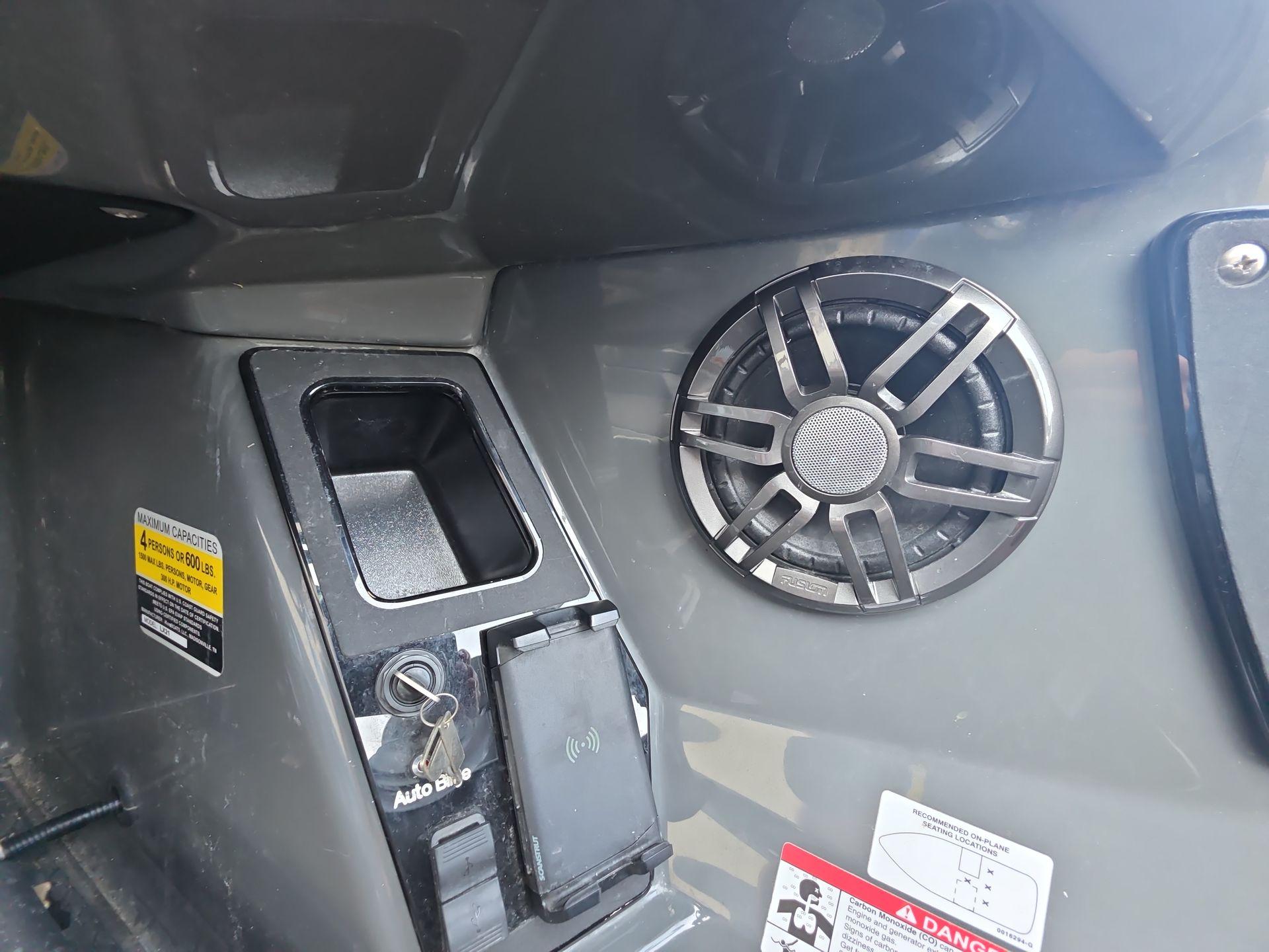 Slide: The Image of Control panel and speaker in 2025 iKon LX21 vehicle interior. - 6