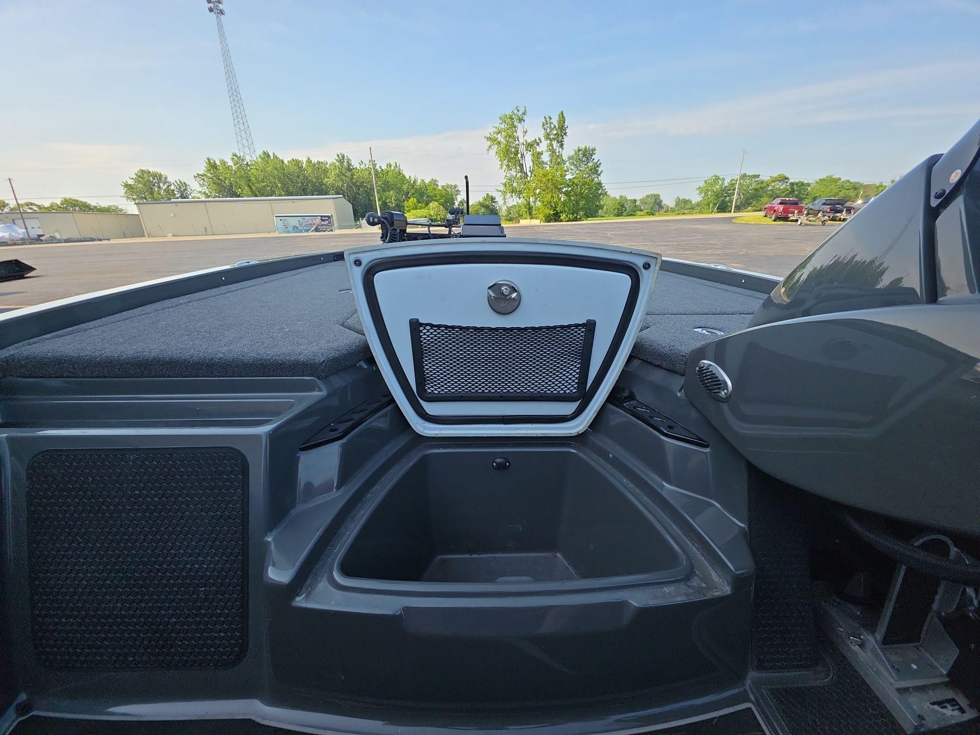 Slide: The Image of Interior view of 2025 iKon LX21 boat, featuring storage compartment and sleek design. - 7
