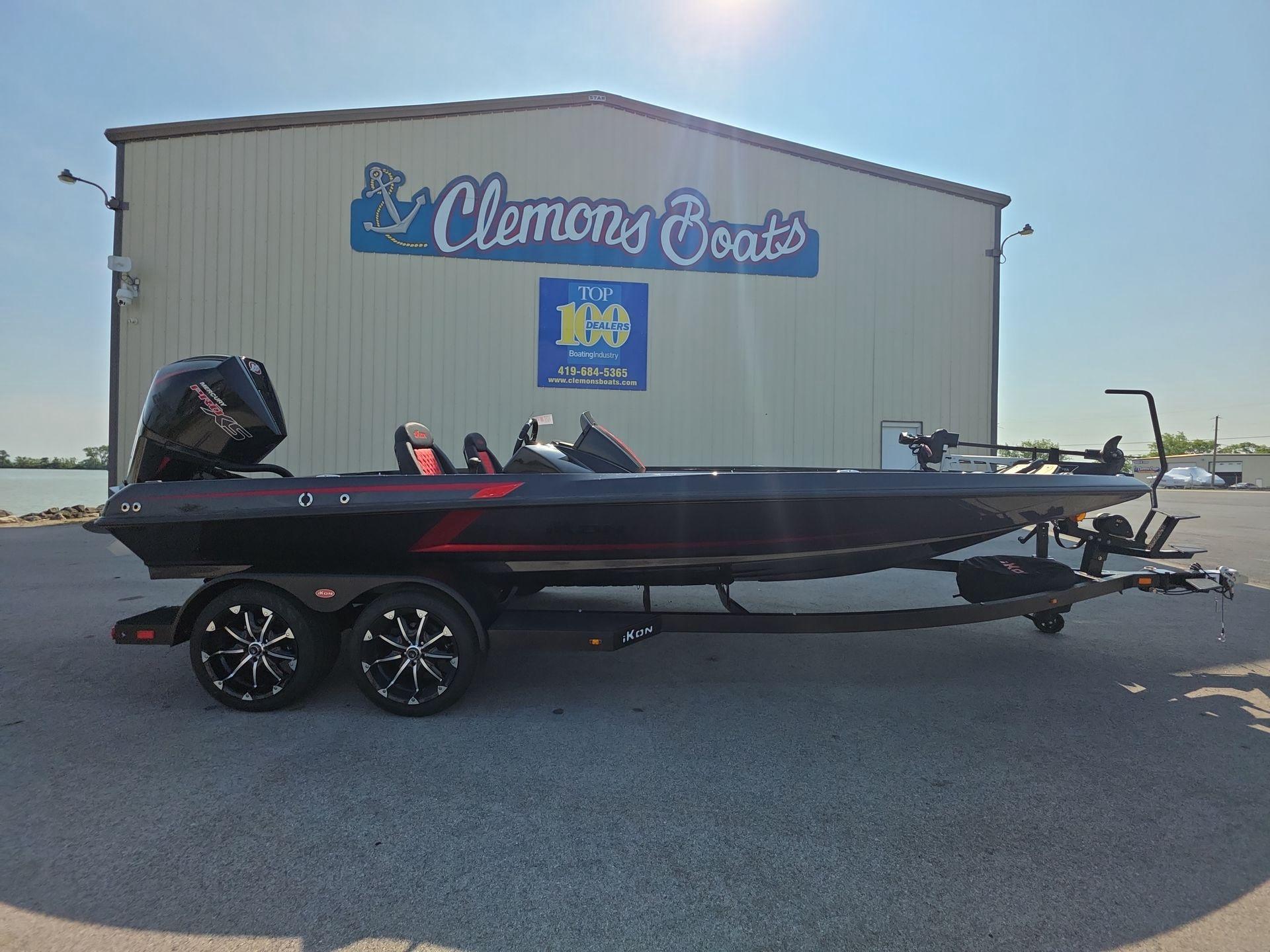 Slide: The Image of 2026 iKon LX21 boat at Clemons Boats dealership, featuring sleek design and modern features. - 0