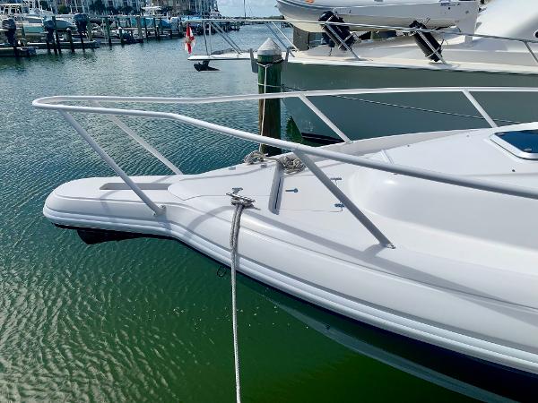 Slide: The Image of 2002 Intrepid 348 Walkaround boat docked in marina. - 4