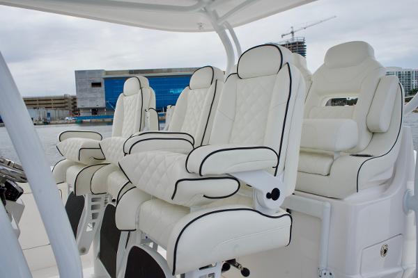Slide: The Image of Luxurious white leather seats on the 2023 Intrepid 475 Panacea boat. - 11