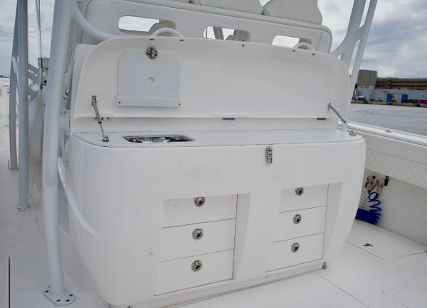 Slide: The Image of 2023 Intrepid 475 Panacea boat interior with storage drawers and sink. - 14