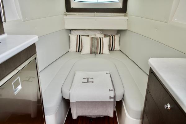 Slide: The Image of Luxurious cabin interior of 2023 Intrepid 475 Panacea with cozy bed and stylish decor. - 17