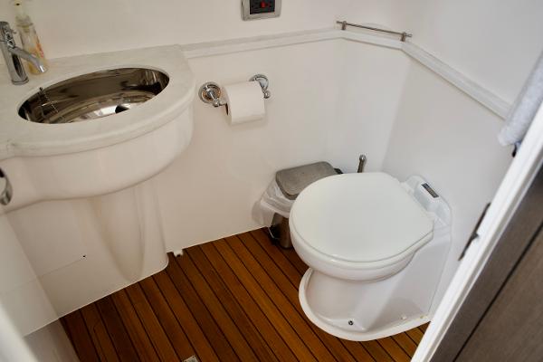 Slide: The Image of 2023 Intrepid 475 Panacea bathroom with modern fixtures and wooden flooring. - 20