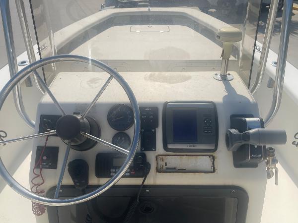 Slide: The Image of 2006 Intruder Pro Marine 20 boat dashboard with steering wheel and navigation controls. - 9