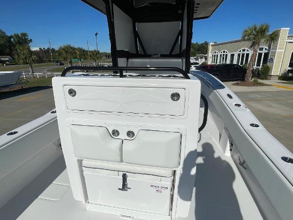 Slide: The Image of 2024 Invincible 33 Open Fisherman boat interior, featuring helm station and seating. - 10