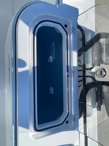 Slide: The Image of 2024 Invincible 33 Open Fisherman livewell compartment. - 13