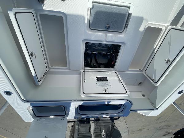 Slide: The Image of 2024 Invincible 33 Open Fisherman storage compartments and access hatches. - 19