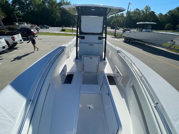 Slide: The Image of 2024 Invincible 33 Open Fisherman boat, front deck view at a dealership. - 27