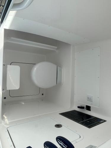 Slide: The Image of 2024 Invincible 33 Open Fisherman boat interior with modern amenities. - 32