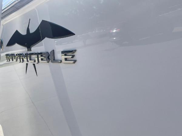Slide: The Image of 2024 Invincible 33 Open Fisherman boat logo on hull. - 6