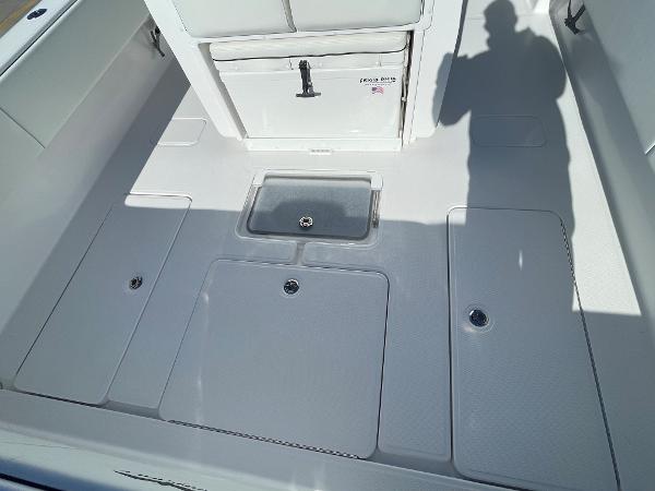 Slide: The Image of 2024 Invincible 33 Open Fisherman deck with storage compartments. - 9