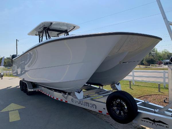 Slide: The Image of 2024 Invincible 35 Catamaran on trailer, side view. - 1