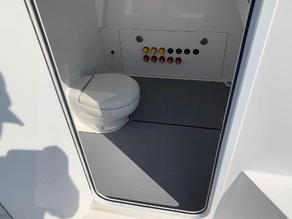 Slide: The Image of 2024 Invincible 35 Catamaran interior bathroom with control panel. - 17