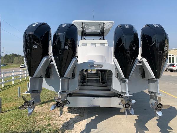 Slide: The Image of 2024 Invincible 35 Catamaran with quad outboard engines, rear view. - 3