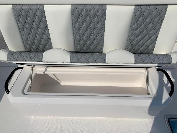 Slide: The Image of 2024 Invincible 35 Catamaran seat with storage compartment open. - 4