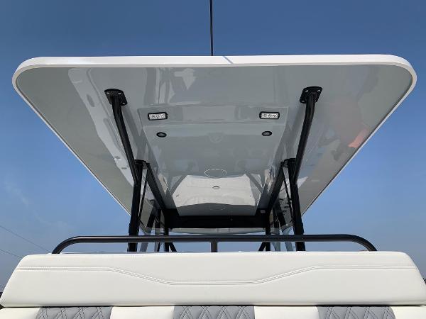 Slide: The Image of 2024 Invincible 35 Catamaran T-top with integrated lights and sleek design. - 6