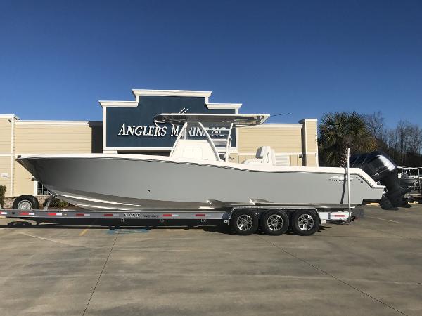 Slide: The Image of 2024 Invincible 36 boat on trailer at Anglers Marine dealership. - 0