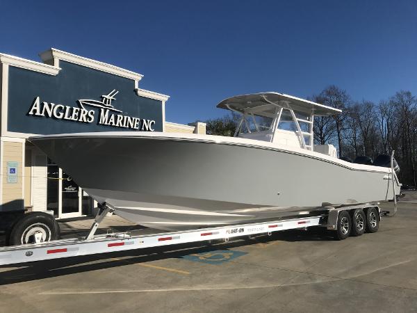 Slide: The Image of 2024 Invincible 36 boat on trailer at Anglers Marine NC dealership. - 1