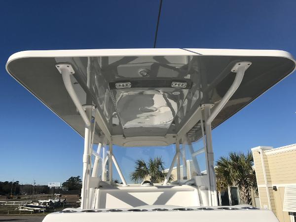 Slide: The Image of 2024 Invincible 36 boat T-top under clear blue sky - 21