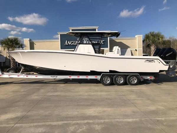 Slide: The Image of 2024 Invincible 36 boat on a trailer at Angler's Marine Inc. dealership. - 1