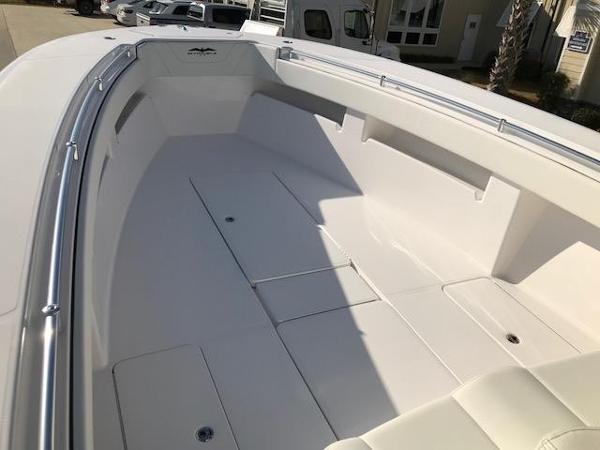 Slide: The Image of 2024 Invincible 36 boat interior, spacious deck with storage compartments. - 13