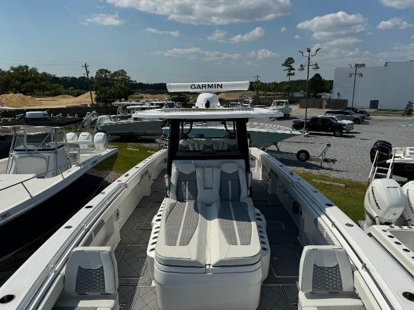 Slide: The Image of 2024 Invincible 40 Catamaran with Garmin equipment, docked in a marina under a clear sky. - 11