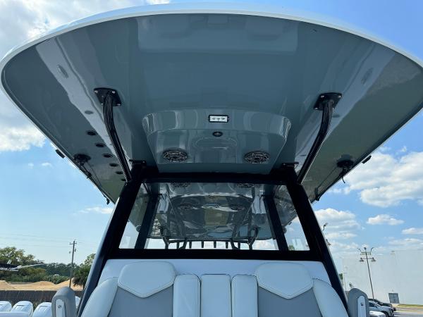 Slide: The Image of 2024 Invincible 40 Catamaran boat with sleek design and modern features. - 16