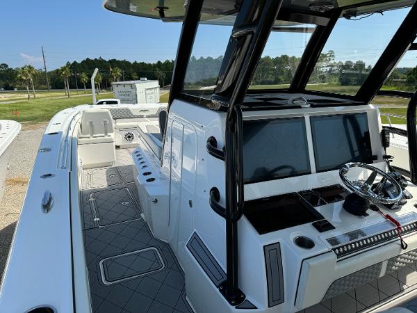 Slide: The Image of 2024 Invincible 40 Catamaran interior with modern helm and seating. - 17