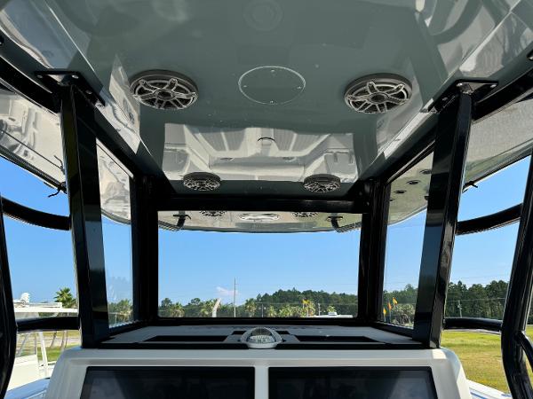 Slide: The Image of 2024 Invincible 40 Catamaran interior with speakers and sleek design. - 19