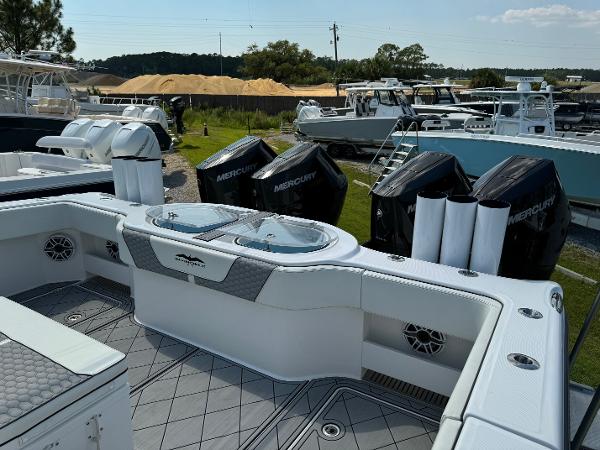 Slide: The Image of 2024 Invincible 40 Catamaran with Mercury engines, docked in a marina. - 22