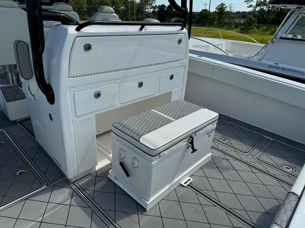 Slide: The Image of 2024 Invincible 40 Catamaran interior with seating and storage compartments. - 23