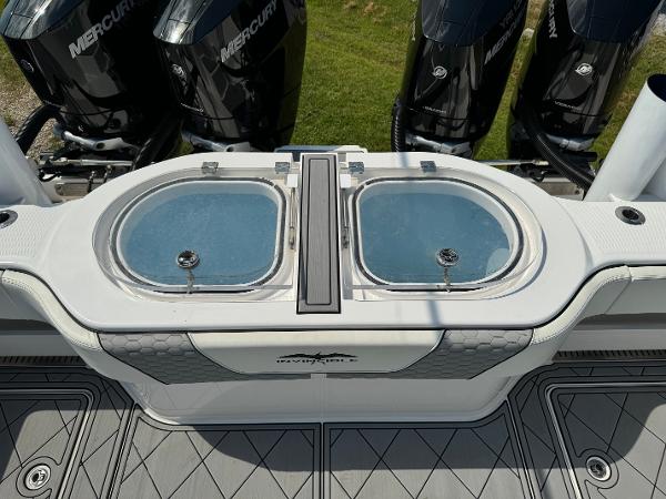 Slide: The Image of 2024 Invincible 40 Catamaran with dual livewells and powerful Mercury outboard engines. - 25